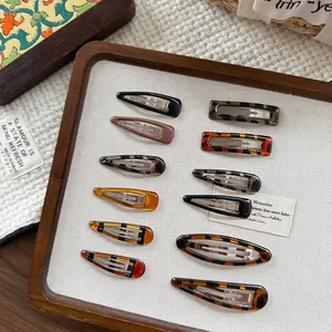 Elegant tortoise shell acrylic hair clips set in vintage amber and brown finishes