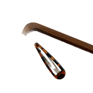 Minimalist leopard print teardrop hair clip with classic tortoiseshell acetate pattern