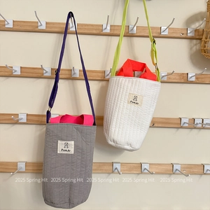 Quilted fabric water bottle crossbody bag with cute bear patch and contrast straps