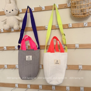 Quilted fabric bucket bag in grey and beige with cute bear pattern and strap