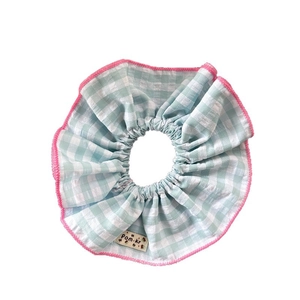 Blue and white checkered oversized scrunchie with pink stitching in pastoral style