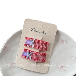 Set of two red plaid hair clips with purple gems and light blue ribbons for girls