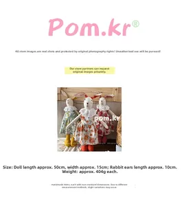 Detailed size view of handmade linen rabbit dolls in floral dresses measuring 50cm in length