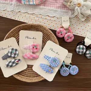 Cute pink and blue plaid hair clips set with cherry embroidery and matching hair ties