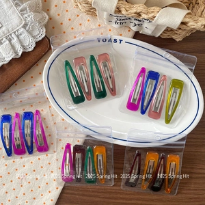 Colorful resin teardrop hair clips 4-piece set in various vibrant translucent finishes