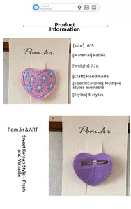Detail view showing handmade 6x5cm embroidered heart fabric clip with sweet floral patterns