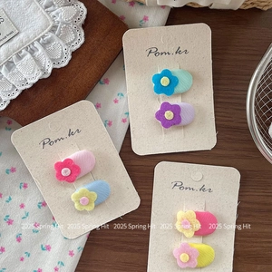 Set of Korean floral fabric oval hair clips in vibrant pink, blue and yellow tones
