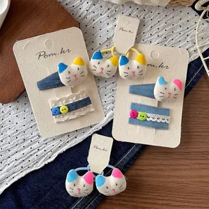 Koreanisches Haarspangen-Set mit Denim-Katzen und Spitze auf einer Trägerkarte