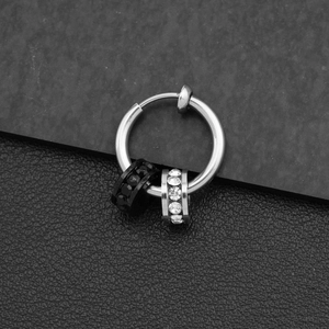 Detail of silver ear clip for non-pierced ears with black and white zircon stone charms