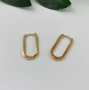 Minimalist gold rectangular hoop earrings with secure click closure on white background