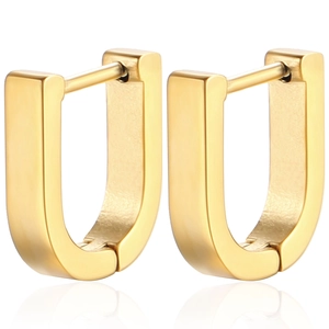 Macro view of minimalist U-shaped golden geometric earrings with high polish finish