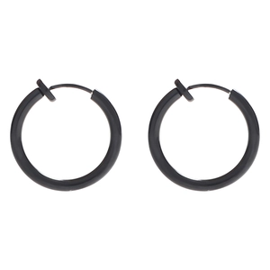 Close-up of black polished clip-on earrings for non-pierced ears in a minimalist style