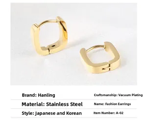 Close-up of gold-plated U-shaped stainless steel earrings on a white textured fabric