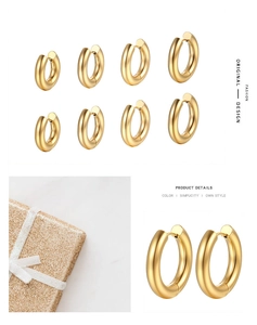 Detailed set of four different sizes of polished gold hoop earrings in a premium gift box