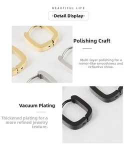 Detailed view of polished U-shaped geometric earrings in gold, silver, and black finishes