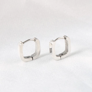 Minimalist U-shaped stainless steel hoop earrings with brushed silver metal texture