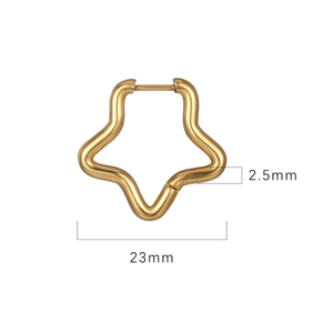 Detailed macro view showing the 23mm diameter of a gold star-shaped stainless steel hoop earring
