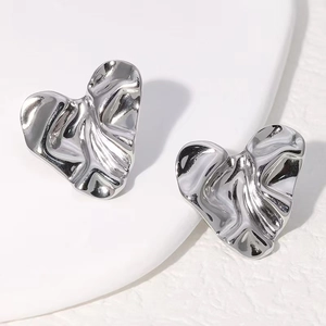 Minimalist silver heart earrings featuring a unique liquid metal fluid texture design
