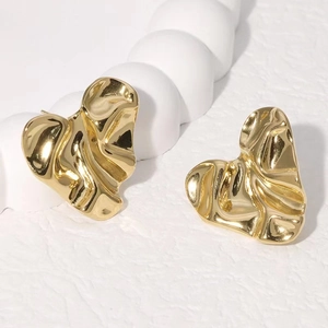 Minimalist gold heart stud earrings with irregular liquid lava texture in 18k gold plating