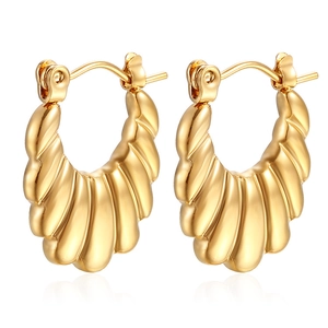 Detailed view of gold plated croissant dome hoop earrings in polished stainless steel