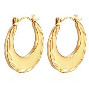 Close-up of 18K gold-plated stainless steel hoop earrings with textured wave pattern