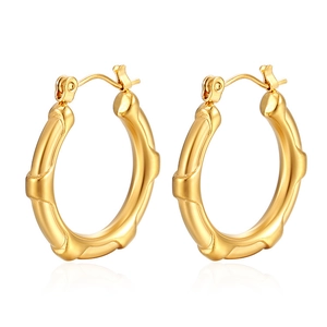 Detailed view of 18K gold plated hoop earrings featuring a bamboo texture and high polish