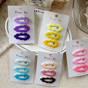 Set of wavy cloud-shaped hair clips in five colors for girls on white cardboards