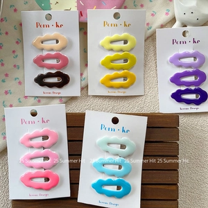 Sweet candy-colored wavy hair clips set for girls displayed on a wooden tray