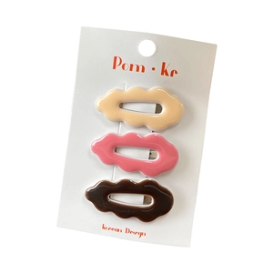 3-piece wavy hair clip set for girls in cream, pink and brown on display card