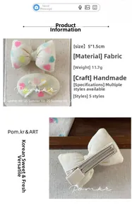 Detail of handmade fabric bow hair clips with colorful heart patterns and pearl beads