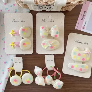 Five-piece Korean hair accessories set with rainbow hearts and bows for girls