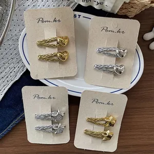 Chic heart and star hair clips with woven texture in gold and silver finish