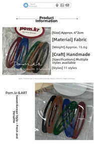 Detailed view of handmade fabric hair clips in deep red, navy, and coffee colors