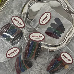 Five-piece matte colorful droplet BB hair clips in retro tones with minimalist packaging