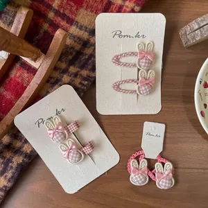 Schattige haarclips met konijnenoren in roze geruite stof en zijden strikjes set