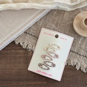 Set of 6 cute polka dot hair clips in cream, mauve, and coffee brown on display card