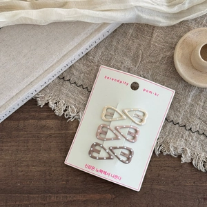 Set of 6 cute polka dot heart hair clips in earthy tones on display card