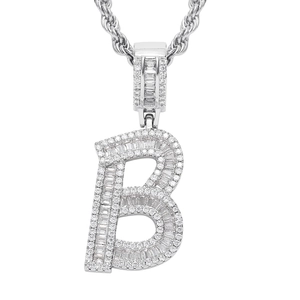 Close-up of iced out silver letter B pendant with baguette stones on a rope chain
