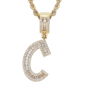 Close-up of hip hop golden letter C pendant with micro-paved cubic zirconia and rope chain