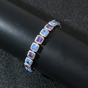 Detail view of square blue and purple zircon stones in halo settings on silver chain