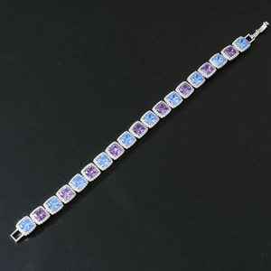 Detailed close-up of 10mm square blue and purple zircon stones on a hip hop chain