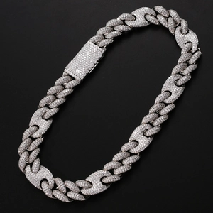 Macro shot of silver-colored iced out Cuban link chain with full zircon crystals