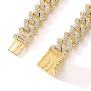 Close-up of a 20mm gold-plated Cuban chain with iced-out box clasp and security locks