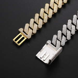 Macro shot of 20MM iced out Miami Cuban link chain with paved zircons in gold and silver