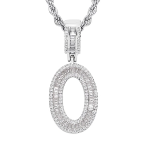 Macro shot of silver hip-hop letter O pendant with cubic zirconia stones on twist chain