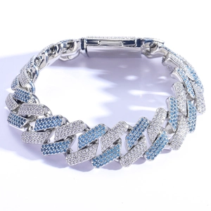 Macro shot of 20mm Cuban link bracelet with pave-set blue and white cubic zirconia crystals