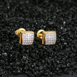 Macro view of gold-plated square pavé stud earrings with secure screw backs