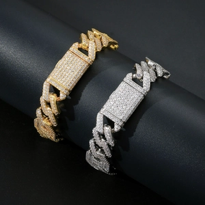 Close-up of 15mm heavy cuban link chains in gold and silver with iced-out zircon pave