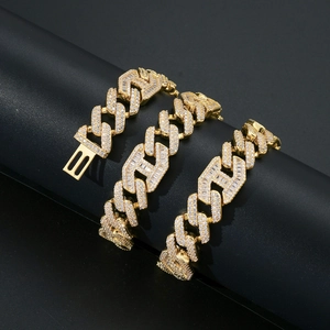 Detail of 15mm gold Cuban link chain with baguette and round micro-pave zircons