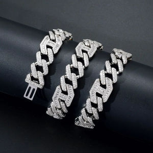 Detail of 15mm silver cuban link chain with baguette diamonds and baguette-cut stones